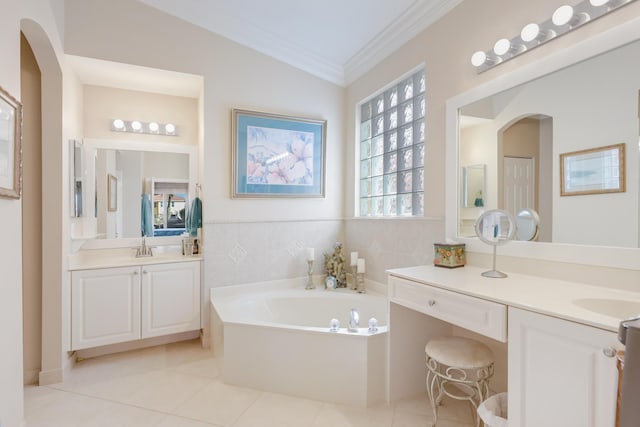 bathroom featuring a bathing tub, tile patterned flooring, crown molding, lofted ceiling, and vanity