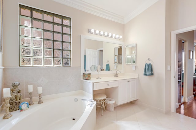 bathroom featuring tile patterned flooring, vanity, a tub to relax in, and crown molding