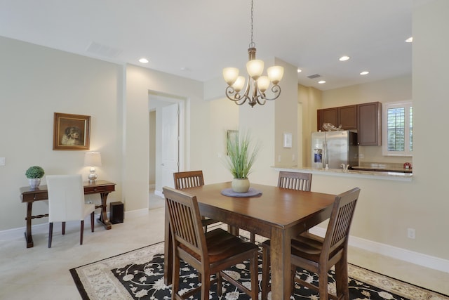 dining space featuring an inviting chandelier, baseboards, visible vents, and recessed lighting