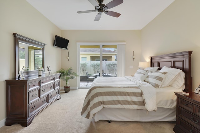 bedroom with light carpet, access to outside, and ceiling fan