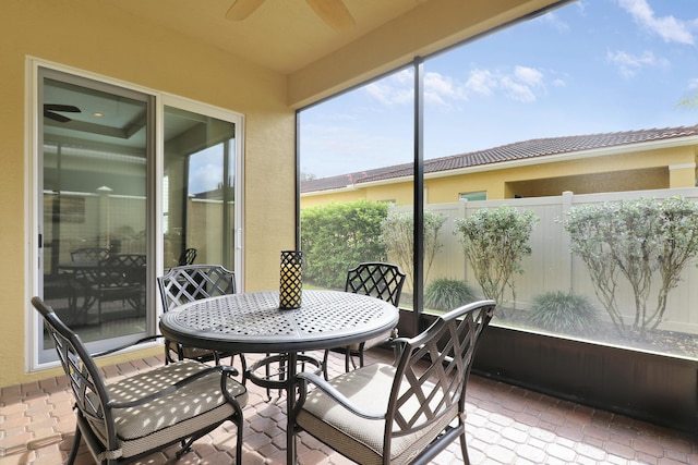 sunroom / solarium with ceiling fan