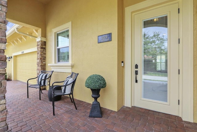 doorway to property with stucco siding