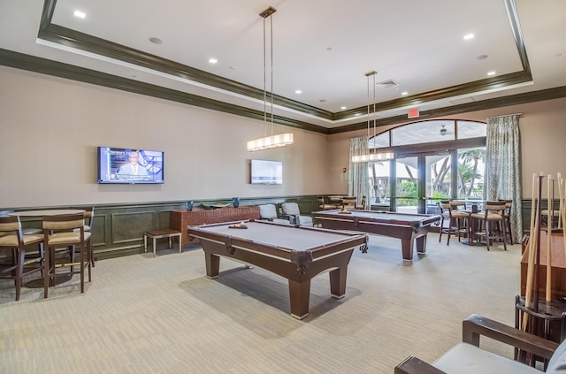 rec room with light carpet, french doors, ornamental molding, pool table, and a tray ceiling