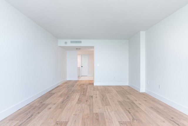 empty room with light hardwood / wood-style floors