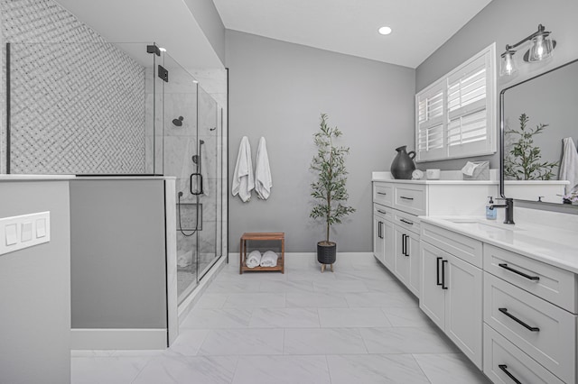 bathroom with vanity and a shower with shower door