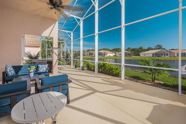 view of patio / terrace featuring an outdoor hangout area, a water view, and ceiling fan