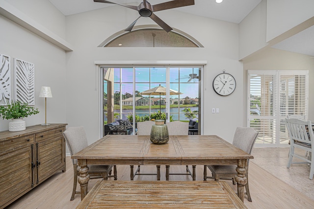 dining area featuring ceiling fan and high vaulted ceiling