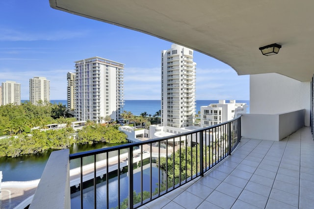 balcony featuring a view of city and a water view