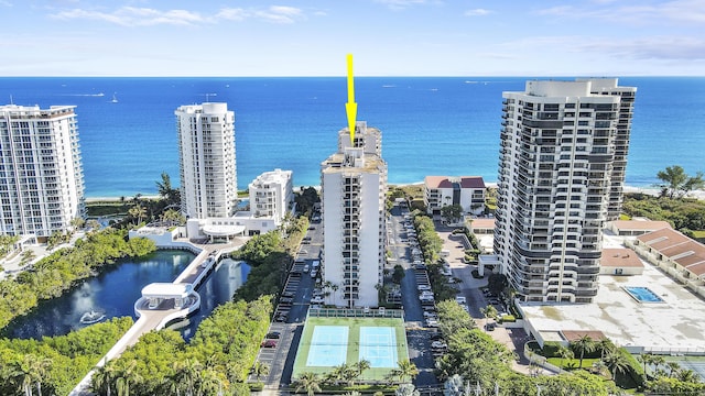 drone / aerial view featuring a water view and a city view