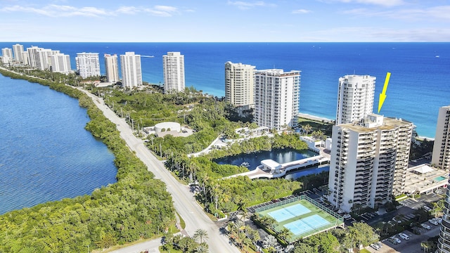 birds eye view of property featuring a water view and a city view