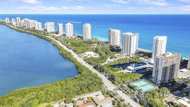 birds eye view of property featuring a view of city and a water view