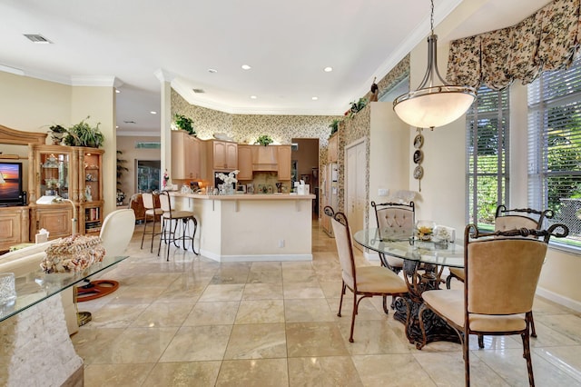 dining area with ornamental molding