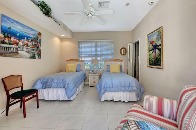 bedroom with ceiling fan and light tile patterned flooring