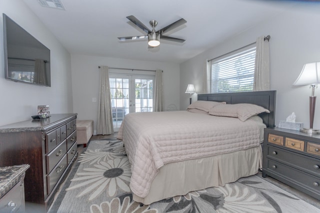 bedroom with ceiling fan, access to outside, and french doors