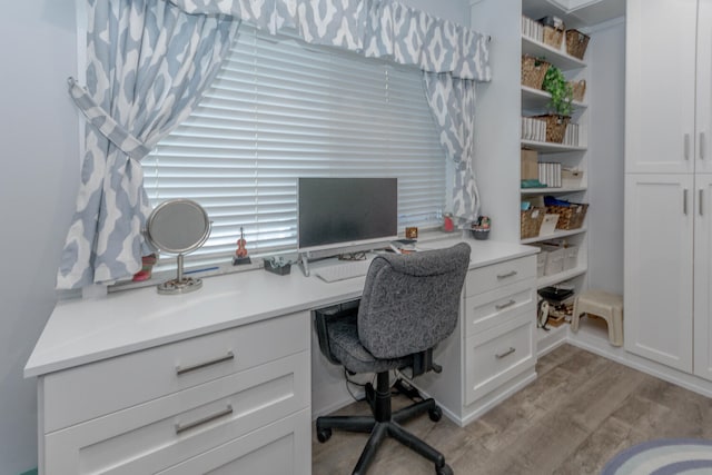 office space with light hardwood / wood-style flooring