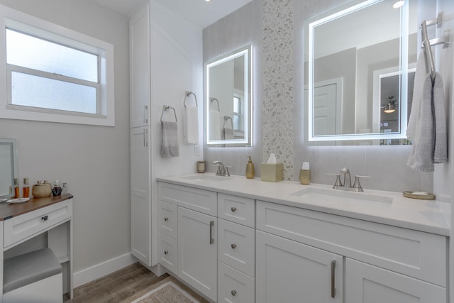 bathroom featuring hardwood / wood-style floors and vanity