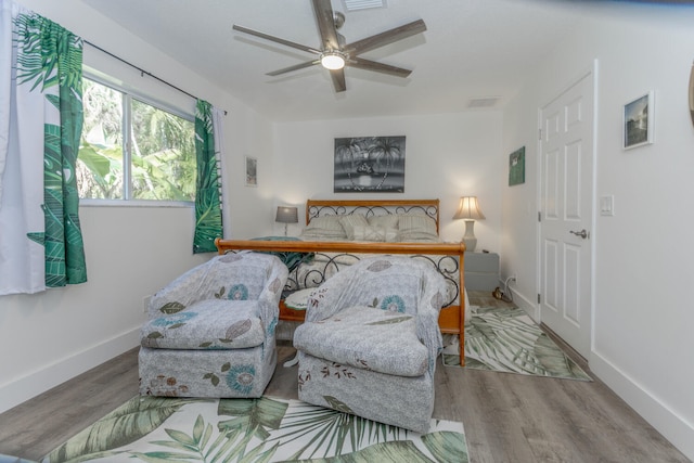 bedroom featuring hardwood / wood-style flooring and ceiling fan