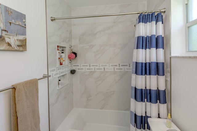 bathroom featuring shower / bathtub combination with curtain