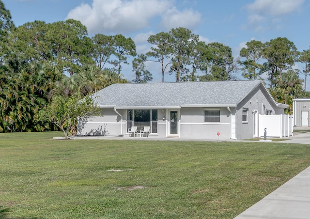 ranch-style house featuring a porch and a front lawn