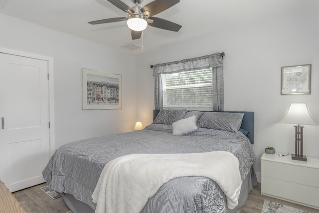 bedroom featuring ceiling fan and light wood-type flooring