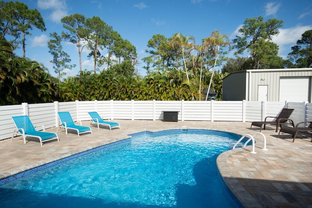 view of swimming pool with a patio