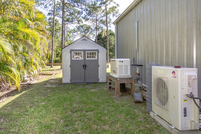 view of outdoor structure featuring a yard and ac unit