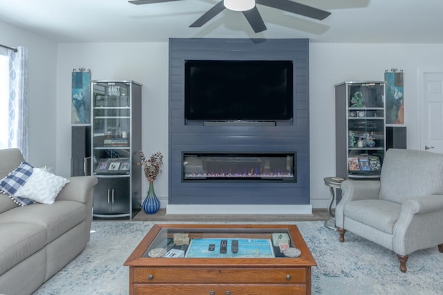 living room featuring a large fireplace