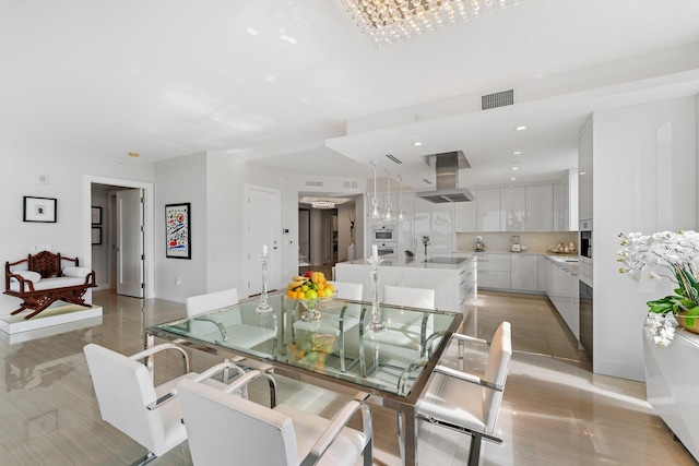 dining space with an inviting chandelier