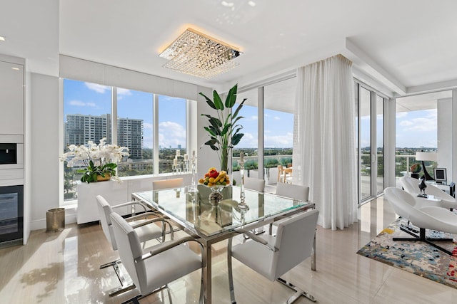 dining area featuring plenty of natural light and a chandelier