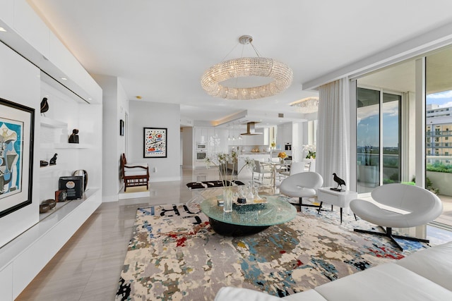 living room featuring tile patterned floors, a wall of windows, and an inviting chandelier