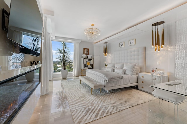 bedroom featuring light tile patterned flooring and a notable chandelier