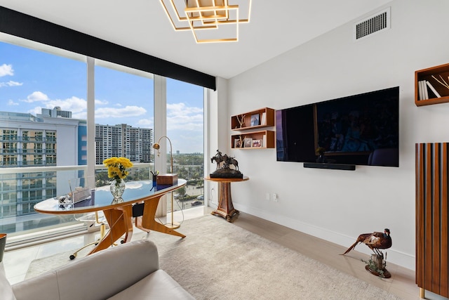 living room featuring floor to ceiling windows and wood-type flooring