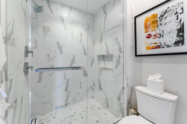 bathroom featuring an enclosed shower and toilet