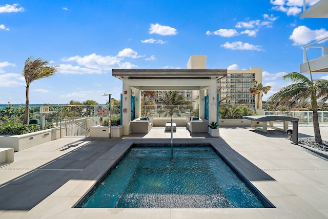 view of pool featuring a patio area, an in ground hot tub, and an outdoor hangout area