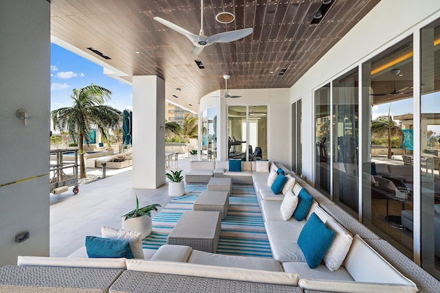 view of patio featuring an outdoor living space and ceiling fan