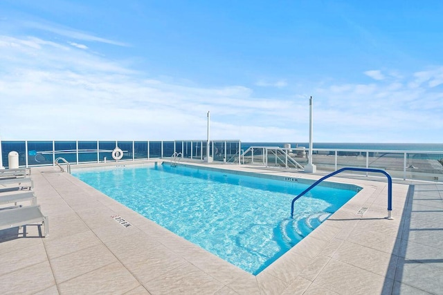 view of swimming pool with a patio area