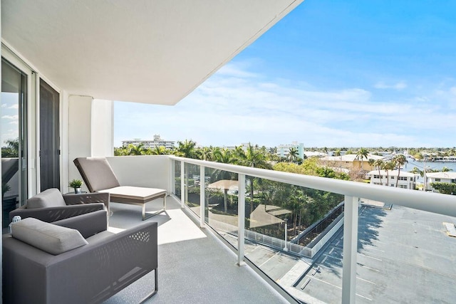 balcony featuring a water view