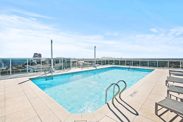 view of swimming pool with a patio area