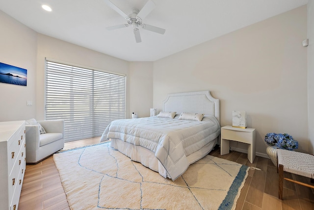 bedroom featuring hardwood / wood-style floors and ceiling fan