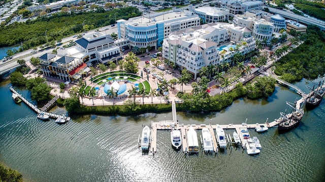 aerial view featuring a view of city and a water view