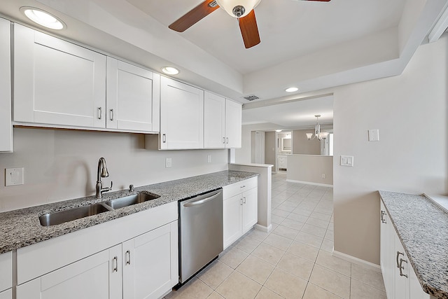 kitchen with a sink, white cabinetry, and dishwasher