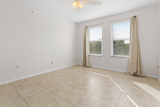 unfurnished room featuring light tile patterned floors and ceiling fan