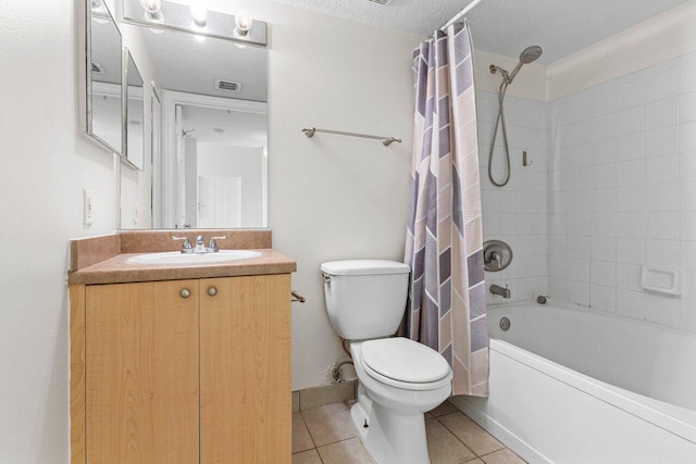 full bathroom with tile patterned flooring, vanity, toilet, shower / bath combo, and a textured ceiling