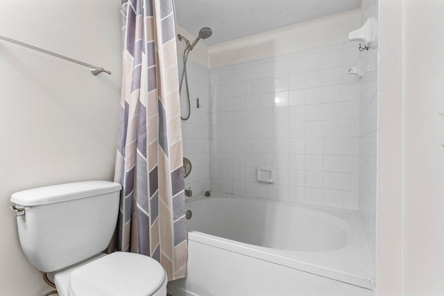 bathroom with shower / tub combo with curtain and toilet