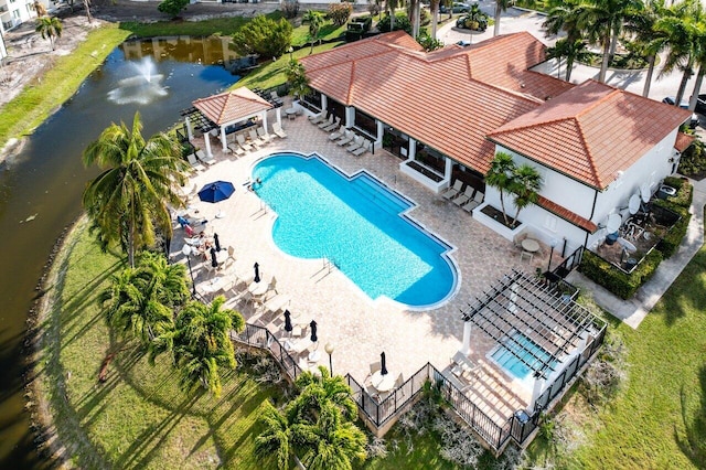 view of pool with a gazebo, a water view, and a patio area