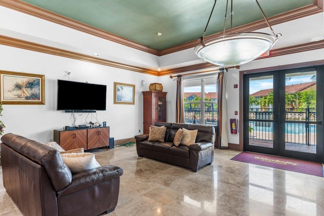 living room with ornamental molding and french doors