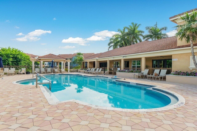 view of swimming pool featuring a patio area