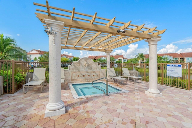 view of swimming pool featuring a community hot tub, a patio, and a pergola