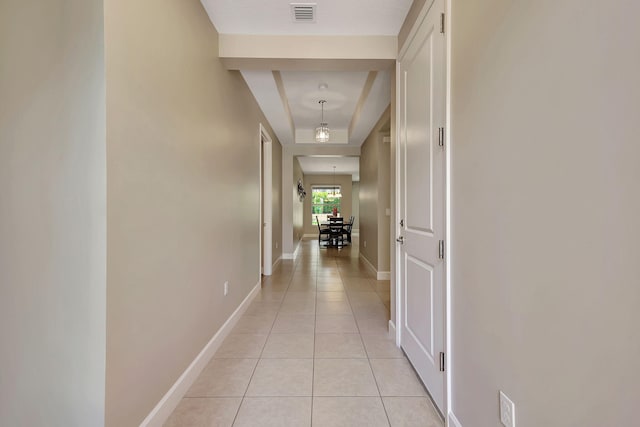 hallway featuring light tile patterned flooring