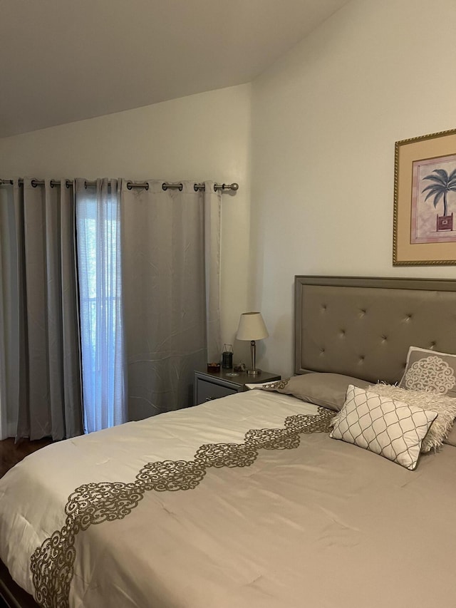 bedroom featuring dark hardwood / wood-style flooring